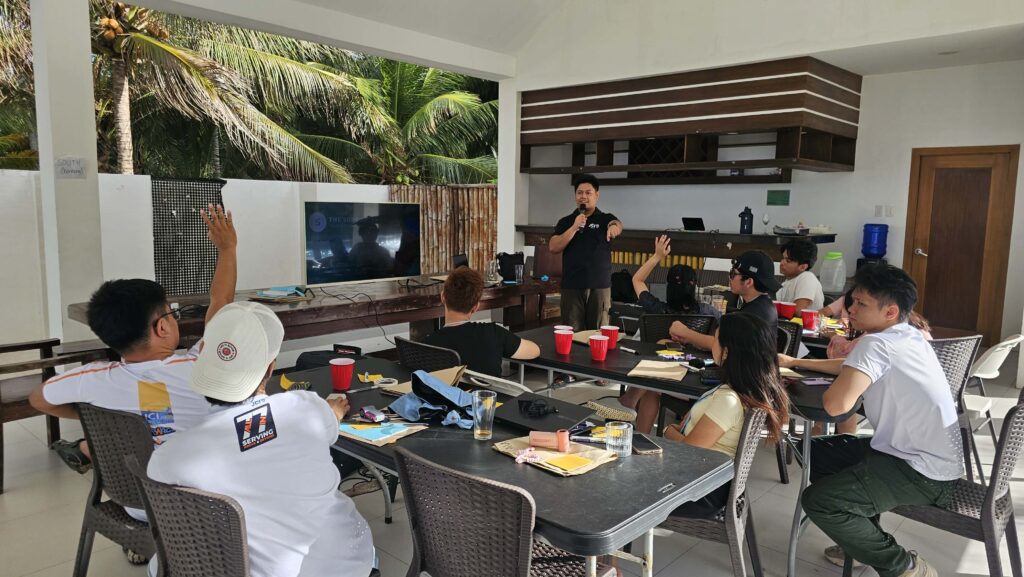 Ralph dela Cerna presenting the Leadership Styles session during JCI leadership training at Spark To Impact 2026 in Mati City.